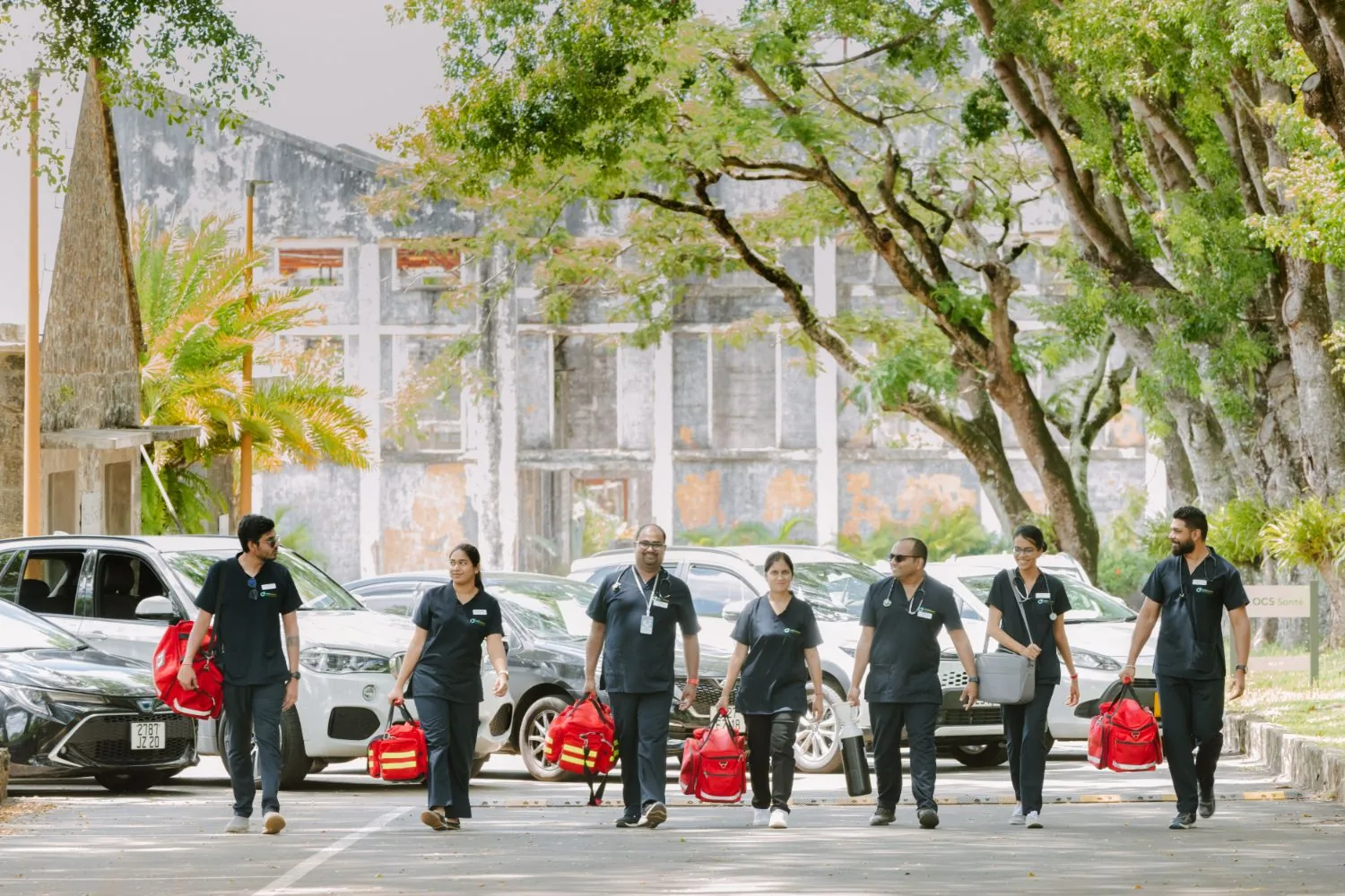The OCS Médecins doctors heading out on home visits with their medical bags