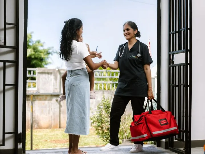 OCS Médecins home visit doctor greeting a patient at home in Mauritius