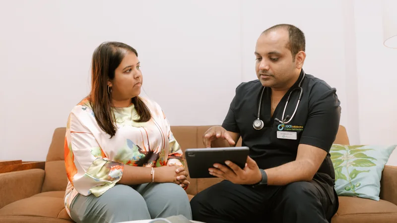 OCS clinician discussing a care plan with a woman at home.