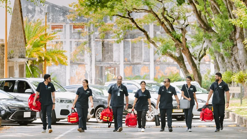 OCS Médecins team walking beside their vehicles with medical bags